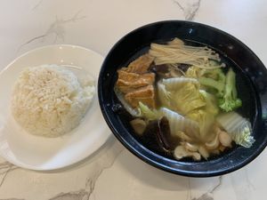 Clear veggie soup with ricee  at Botanict 豐之素 in West Singapore