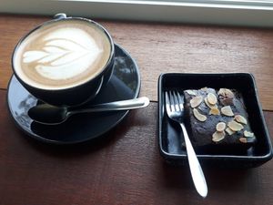 Soy latte with vegan brownie at What's Cup! in Koh Phangan
