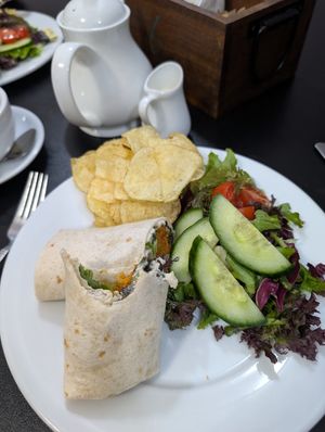 Sweet potato falafel wrap and tea with oat milk at Buttercups in Cromer