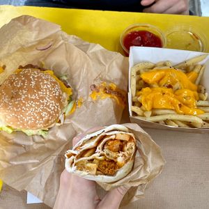 Burger, burrito and cheese loaded fries. at Furahaa - Vegan in Paris