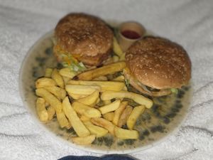Takeaway chicken sandwich and cheeseburger. The chicken was really good. at Furahaa - Vegan in Paris