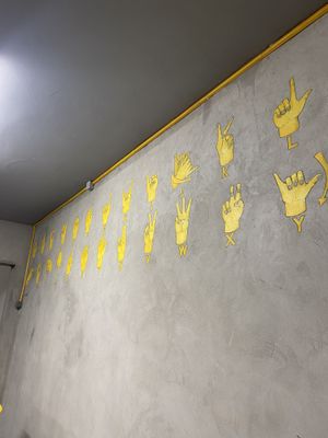Sign language (they hire deaf-mute employees)  at Furahaa - Vegan in Paris