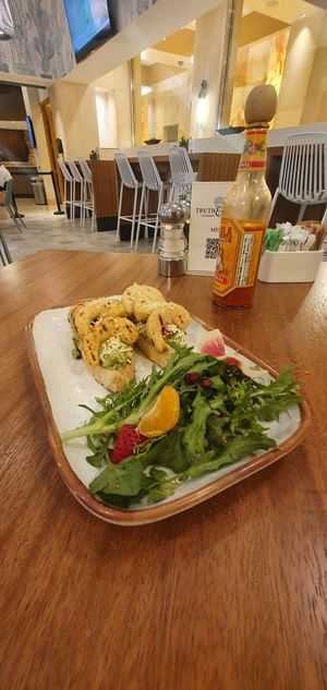 GARLIC PLANT-BASED SHRIMP & AVOCADO TOAST: Heirloom Tomatoes, Lemon, Parmesan Cheese at Truth & Tonic in Las Vegas