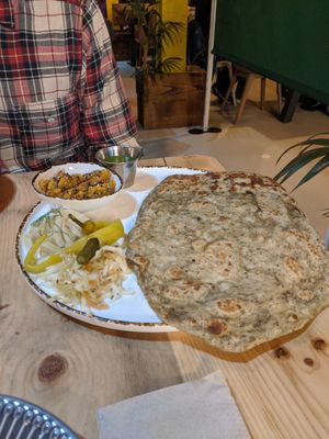Sage za'atar flatbread with pickles, pumpkin tirshy dip and walnut dukkah and lovage oil at V or V in Sheffield