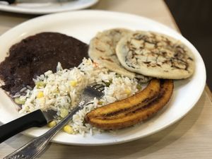 Pupusa platter with beans, rice, and plantano at Rinconcito Salvadoreño in Port Chester