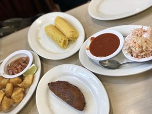 Yuca, steamed corn tamale, vegan empanada made with plantanos and beans  at Rinconcito Salvadoreño in Port Chester