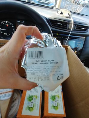 Grab and go near checkout counter: $5.49 Vegan Sausage Biscuit, not a fan, biscuit too dry at West Village Market and Deli in Asheville