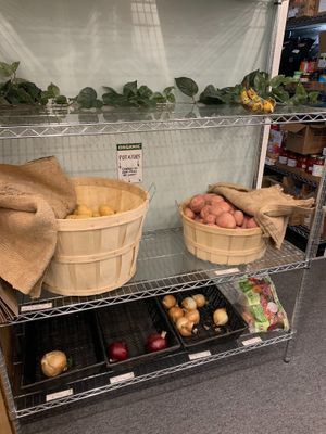Bananas, spuds and onions.  at The Local Food Market in Tully