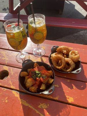 Onion rings and patatas bravas and Pimms   at Brewhouse and Kitchen in Bristol