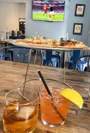 Pizza, cocktails,  and football (soccer)   at Westy's Tap & Tavern in Aspen