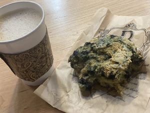 Oat milk cappuccino and blueberry biscuit   at Breads On Oak - Carondelet St in New Orleans