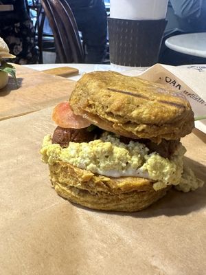 Pumpkin cheddar biscuit with tofu scramble and field roast sausage  at Breads On Oak - Carondelet St in New Orleans