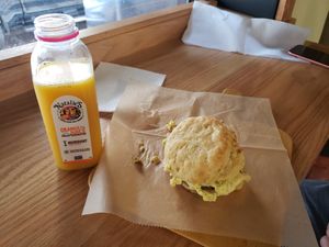 Egg sausage biscuit, fresh OJ at Breads On Oak - Carondelet St in New Orleans