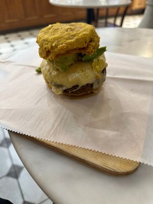 Cheddars pumpkin biscuit, garbanzo sausage, tofu scramble, provolone, avocado   at Breads On Oak - Carondelet St in New Orleans