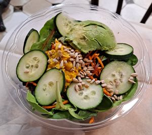 Market Gardener Salad: Avocado, Carrots, Cucumber, Chickpea Eggless Salad, Sunflower Seeds,  Organic Greens, Miso Dressing at Breads On Oak - Carondelet St in New Orleans