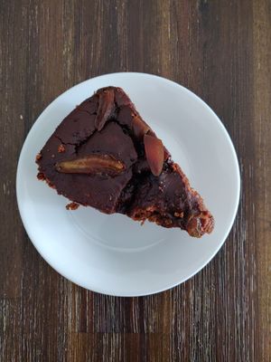 Slice of chocolate cake with fig slices at Bahji Bakery Rosales in Bogota