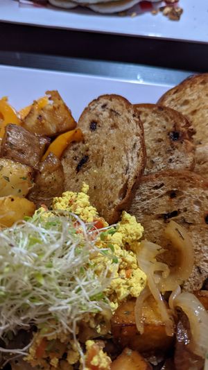 Tofu scramble, toast, potatoes at Antojitos Veganos in Bayamon