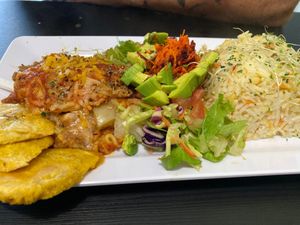 Eggplant lasagna with rice pilaf salad and tostones at Antojitos Veganos in Bayamon