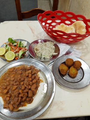 Fuul with tahini, baba ganoush, falafel, and green salad at Mohamed Ahmed in Alexandria