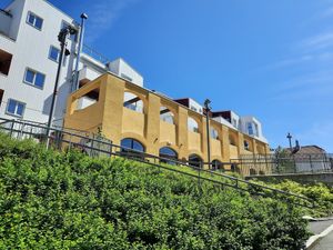 The yellow building is the restaurant. at Bellies in Stavanger