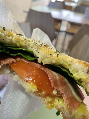 Bacon, tomato, spinach and mustard toast  at Moko Veggie Café - Alvalade in Lisbon