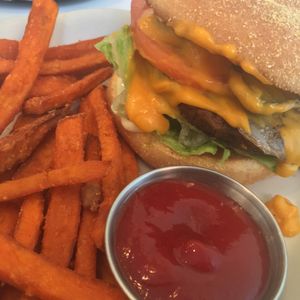 burger with cheese and sweet potato fries- this was amazing. bun was warm and toasty, had pickles, tomato, lettuce, mayo, the cheese was super melty and surprisingly tasty (not like most plasticy vegan cheese), and the meat was so flavourful and great texture (made with brown rice and oats) at Alice & Friends' Vegan Kitchen in Chicago