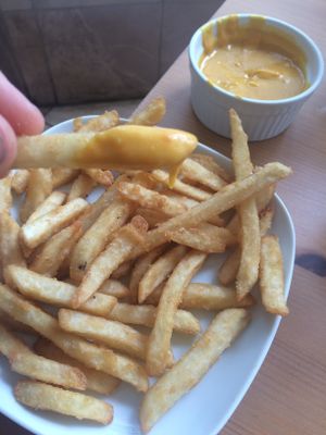 Amazing fries, not like your normal French fries with addictive cheese  at Alice & Friends' Vegan Kitchen in Chicago