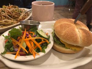  House made burger w/ yummy cheese and a salad w/ delicious cucumber dressing!  at Alice & Friends' Vegan Kitchen in Chicago