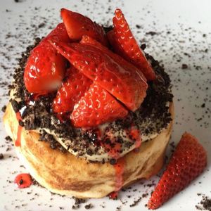 Peanut Butter Frosting with "Oreo" Cookie Crumbs and Strawberries! at Cinnaholic  in Cary