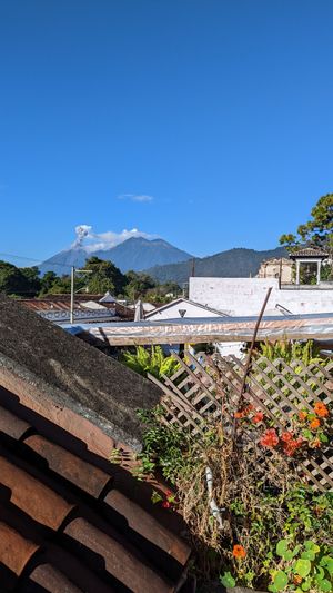 View of Fuego volcano erupting from the terrace!!! at Cafe Bohème   in Antigua