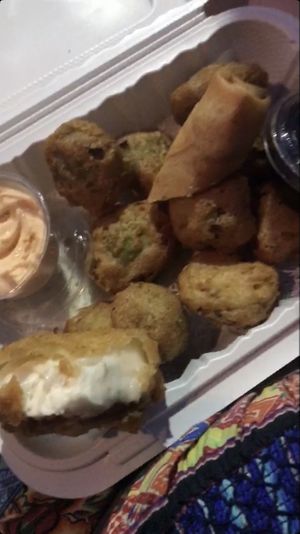 Tempura brussel sprouts, half of a spring roll, tempura cheesecake  at V.L.C Vegan Eatery in Orlando