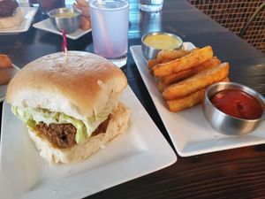 Fried "chicken" sandwich, yuca fries, and "honey" mustard sauce. So good! at Kindred in New Orleans