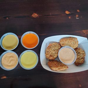 Seitan nuggets Sauces
Kindred Sauce, Buffalo, Agave Mustard, Spicy Mayo, Creamy Lime-Cayenne at Kindred in New Orleans