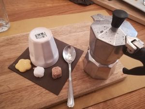 Coffee in Moka with Vegan Biscuit and Sugar at Sfoglia Rina in Bologna