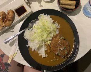Pumpkin curry with yubamaki and spring rolls at Pompoko in Brighton