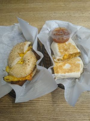 Breakfast sandwich with bacon and chorizo tofu scramble breakfast burritto. at Square One Cafe in Schenectady