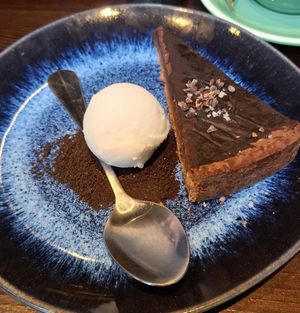 Chocolate and salted caramel tart with coconut ice cream at Bill's - Central in Cardiff
