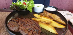 Mushroom steaks and potato wedges at Downtown - Vegan Garden Restaurant in Chiang Mai