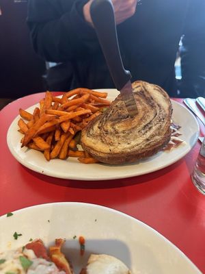 Reuben w/ Sweet Potato Fries (sorry you can't see the inside of the sandwich - it's delicious, just order it) at The Chicago Diner - Lakeview in Chicago