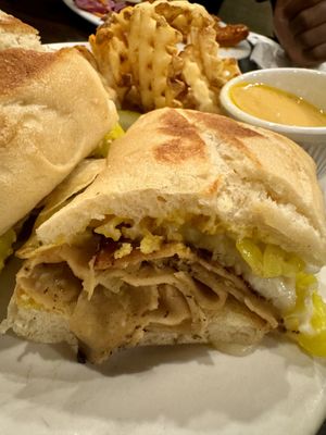Cuban sandwich with a side of waffle fries and vegan cheddar cheese for dipping!  at The Chicago Diner - Lakeview in Chicago