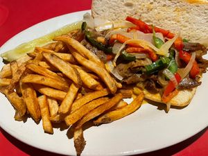 Philly cheesesteak with fries  at The Chicago Diner - Lakeview in Chicago