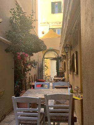 Clever use of the alleyway for a cozy seating area at Bizou Cafe in Corfu