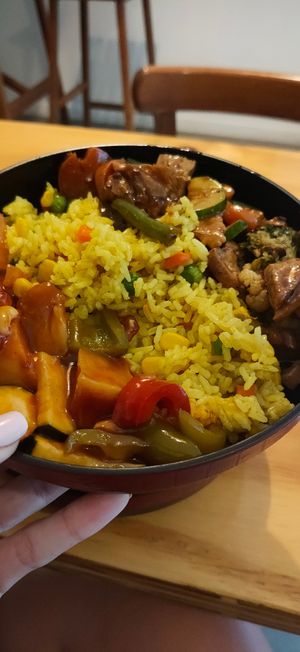 Pumpkin seed fried rice, sweet and sour chicken and black bean tofu at Root Vegetarian in Cairns