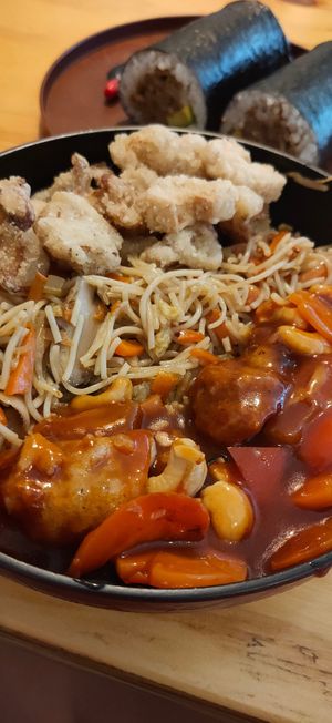 Rice noodles, salt and pepper calamari & sweet and sour chicken at Root Vegetarian in Cairns