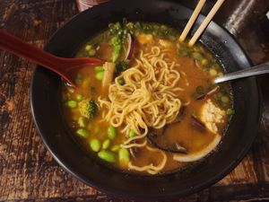 Build your own bowl with vegan miso broth, veggies, and noodles at Bols in Plano