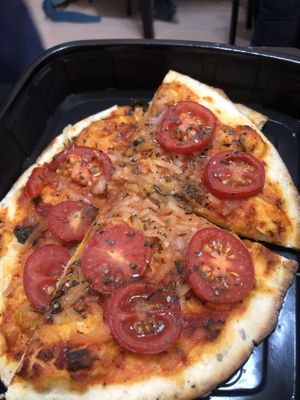 Pizza  (reused an old container because only take away is allowed at the moment due to the pandemic)  at Cute Gastro Pub in Izmir