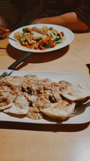 coconut curry & butternut squash ravioli w cashew alfredo sauce. a little heavy on the garlic but so so tasty! at Paliottis Westside in Maple Ridge
