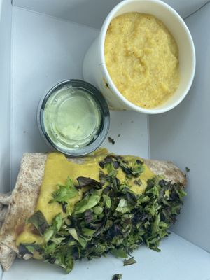 Breakfast burrito with a side of Southern style grits  at Sluggo's North Vegetarian Cafe in Chattanooga