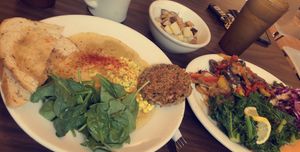 bowl with grits, tofu scramble, sausage, spinach, & sourdough toast  at Sluggo's North Vegetarian Cafe in Chattanooga