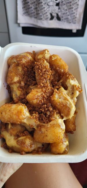 Tater tots with cheese and bacon at PMA Foods in Syracuse